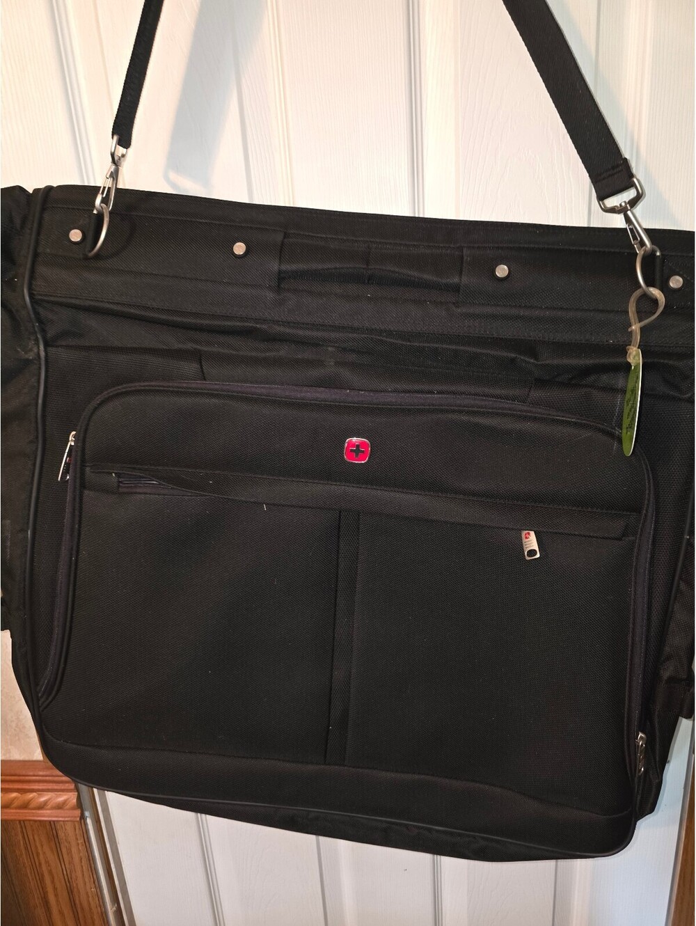 Black garment bag with shoulder strap